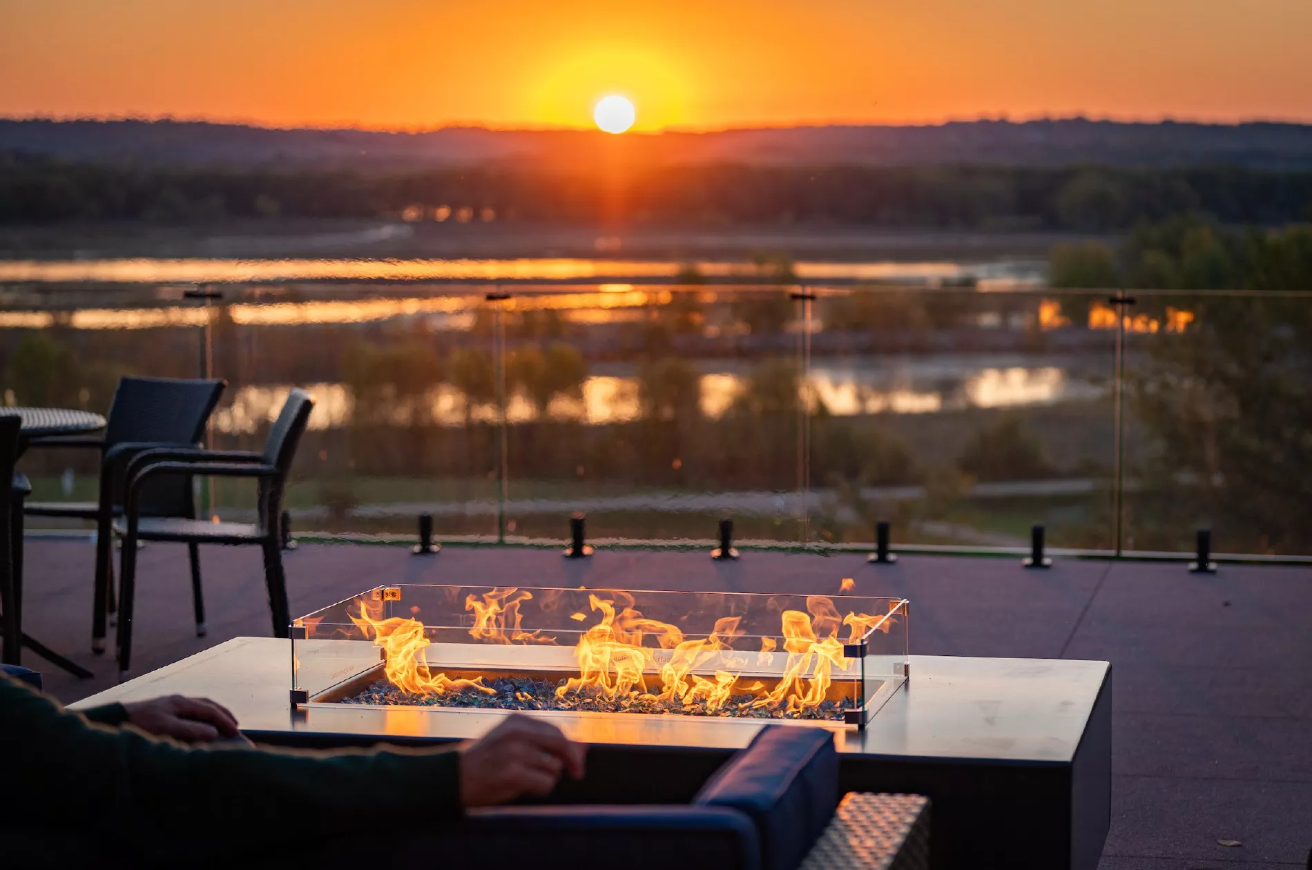 Goldmoor inn outside dining by fire overlooking the river